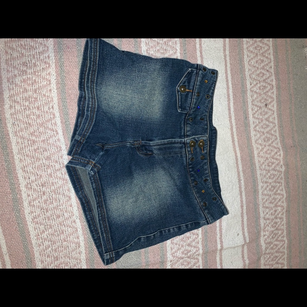 Vintage jean shorts from the 2000s with jewels on the belt